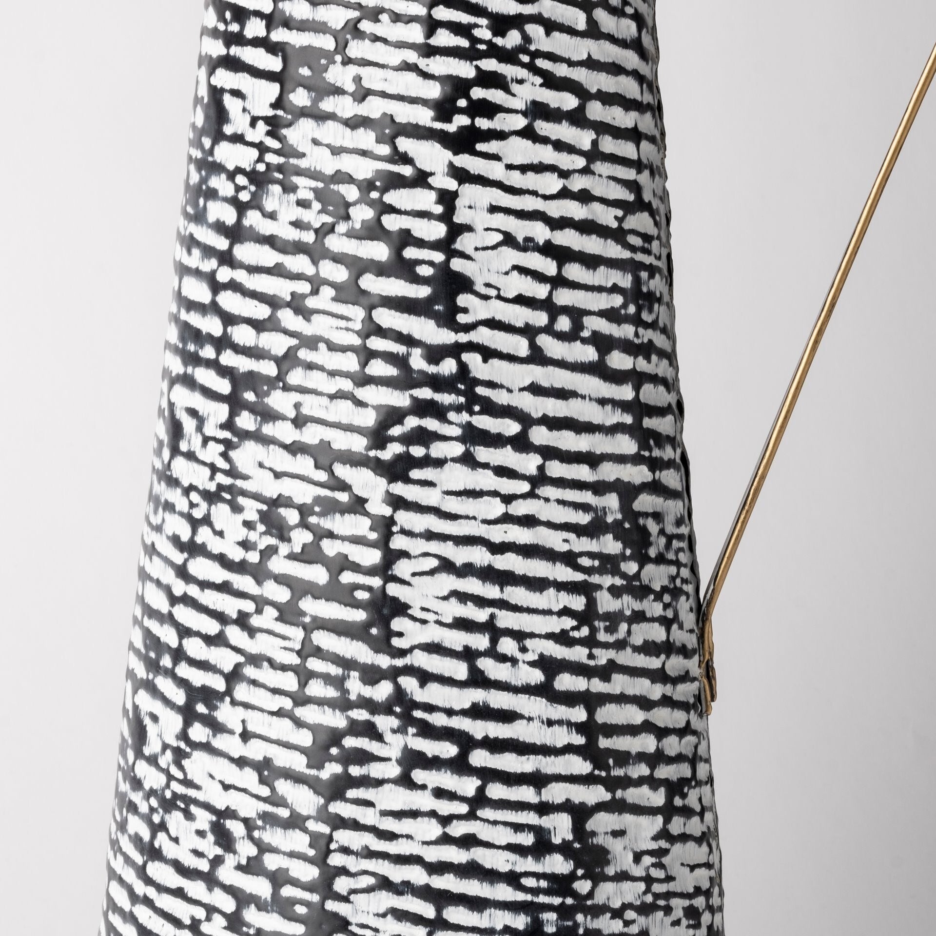 Modern metal vase with textured black white finish and gold trim, statement piece for living room or dining room
