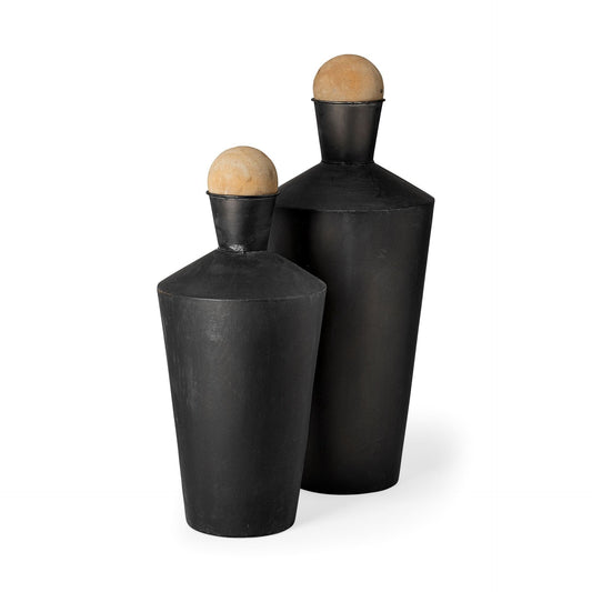 Set of two black and brown metal cylindrical urns with distressed matte finish and wood ball stoppers
