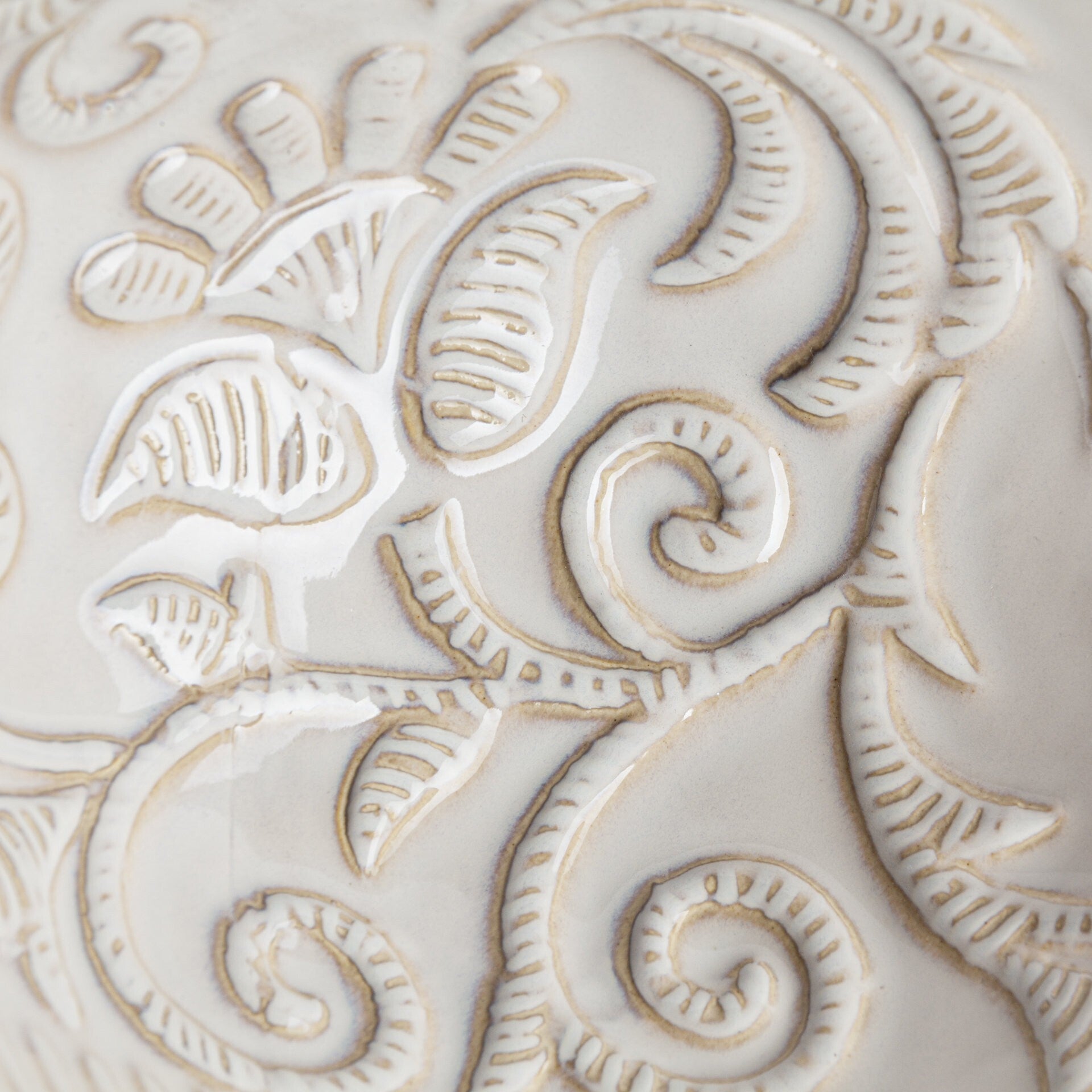 White ceramic carved vase on display, timeless accent for desks and small tables
