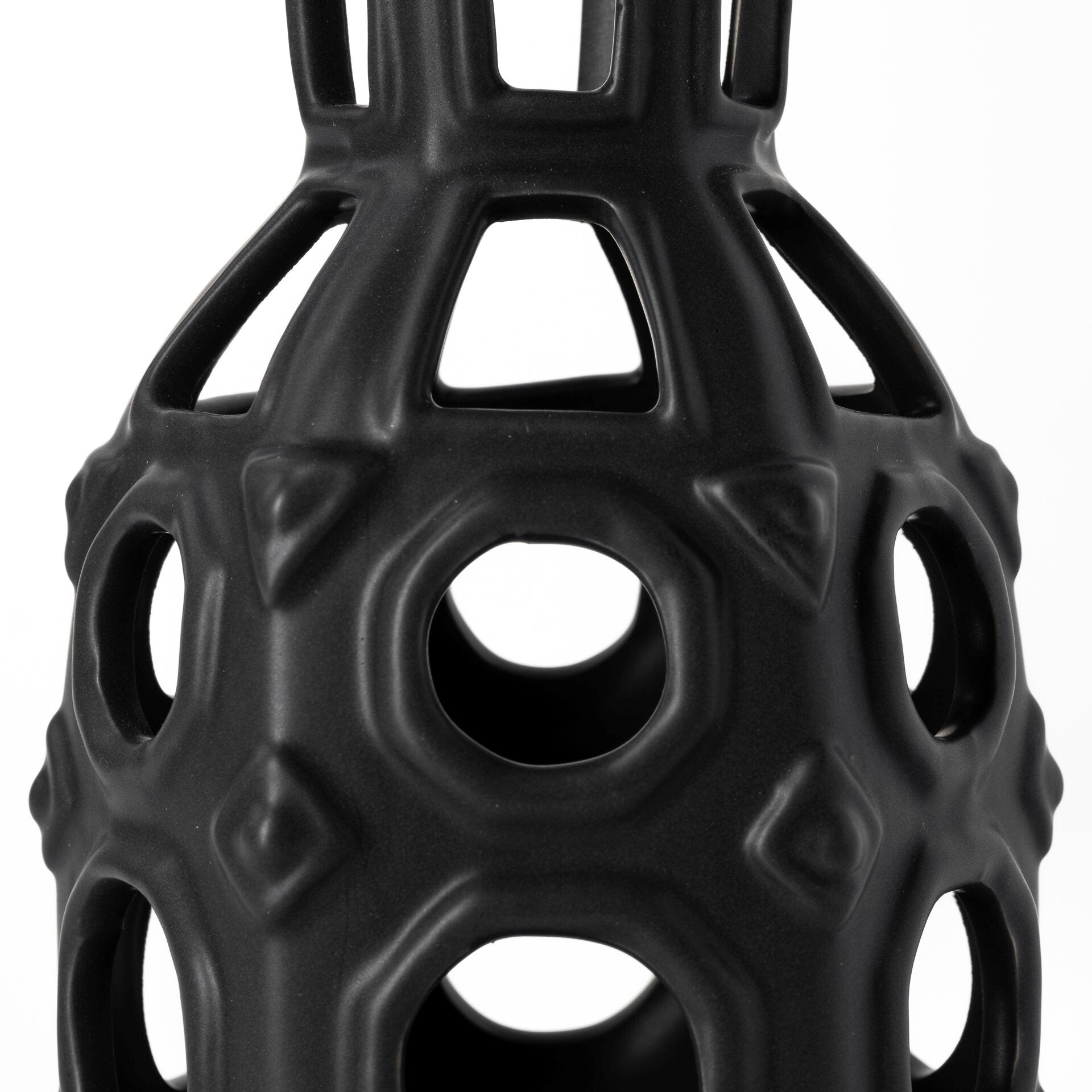 Contemporary black pierced pattern vase with unique circular cutouts for modern home decor
