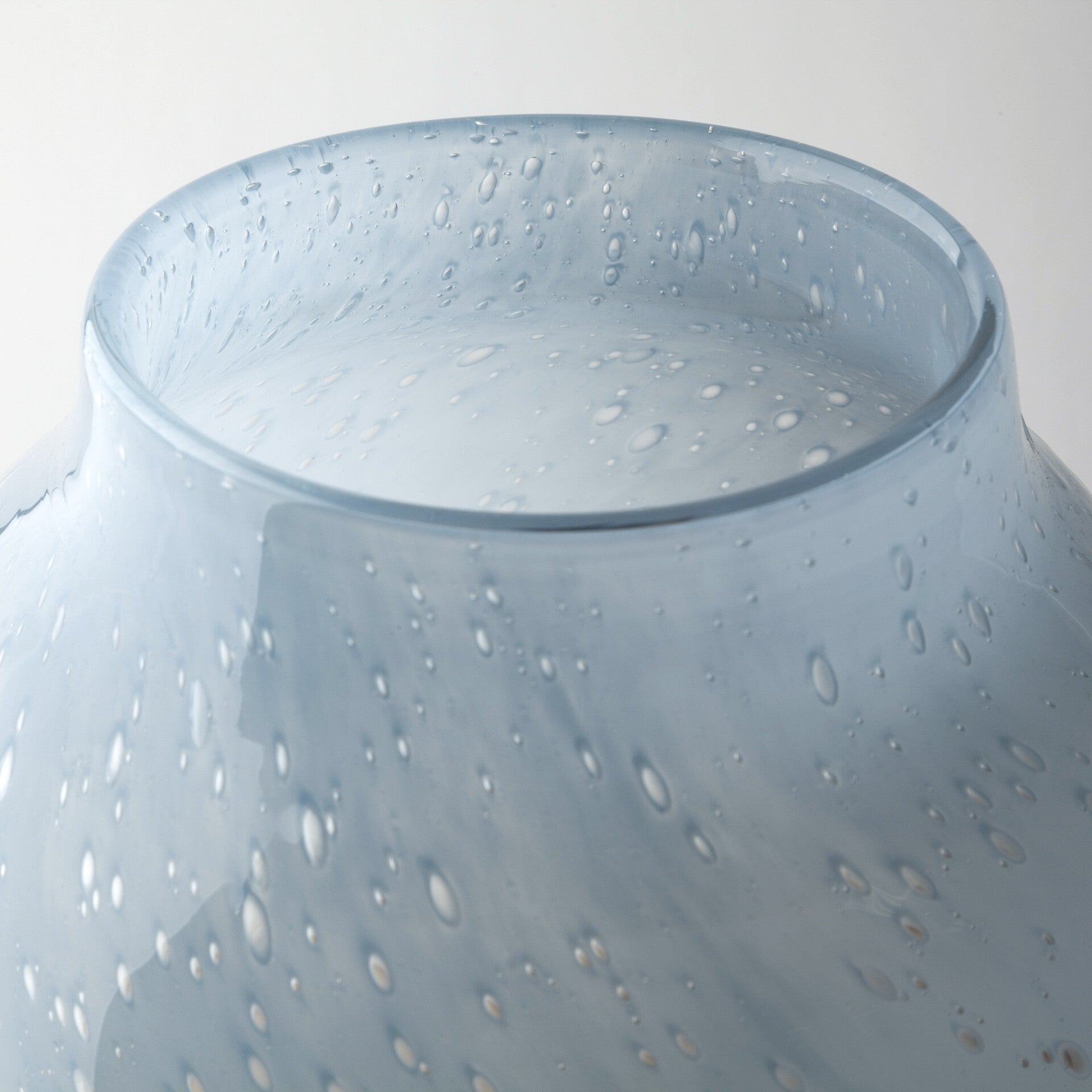 Ocean wave pattern glass vase top opening view perfect for fresh or dried floral arrangements
