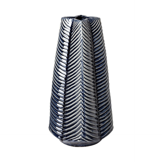 Stunning 16-inch Prussian blue ceramic vase with unique four-pointed star shape and carved striped pattern, translucent navy glaze reveals layered texture, artisan home decor statement piece
