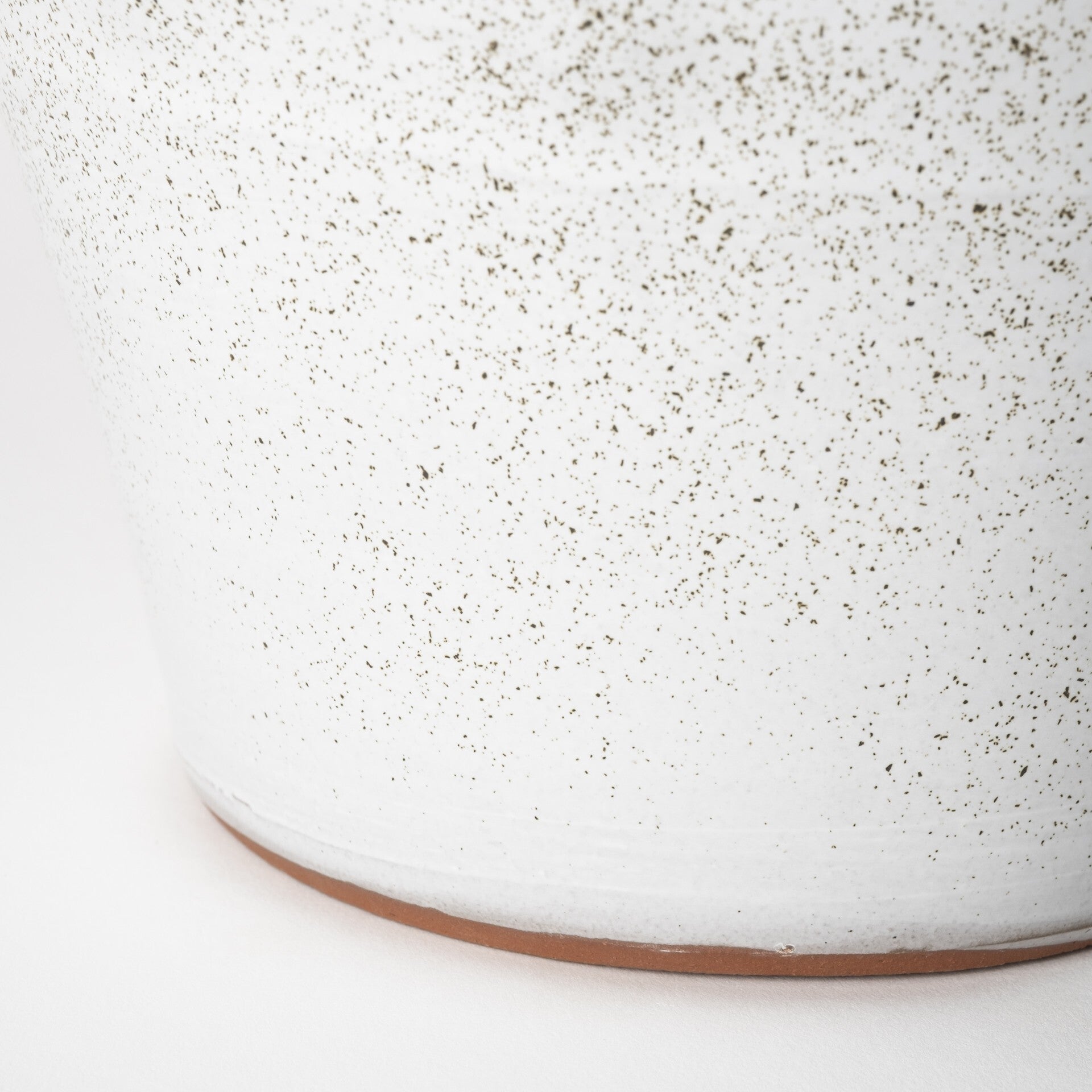 Textured white ceramic vase full view demonstrating 14 inch height ideal for dramatic displays
