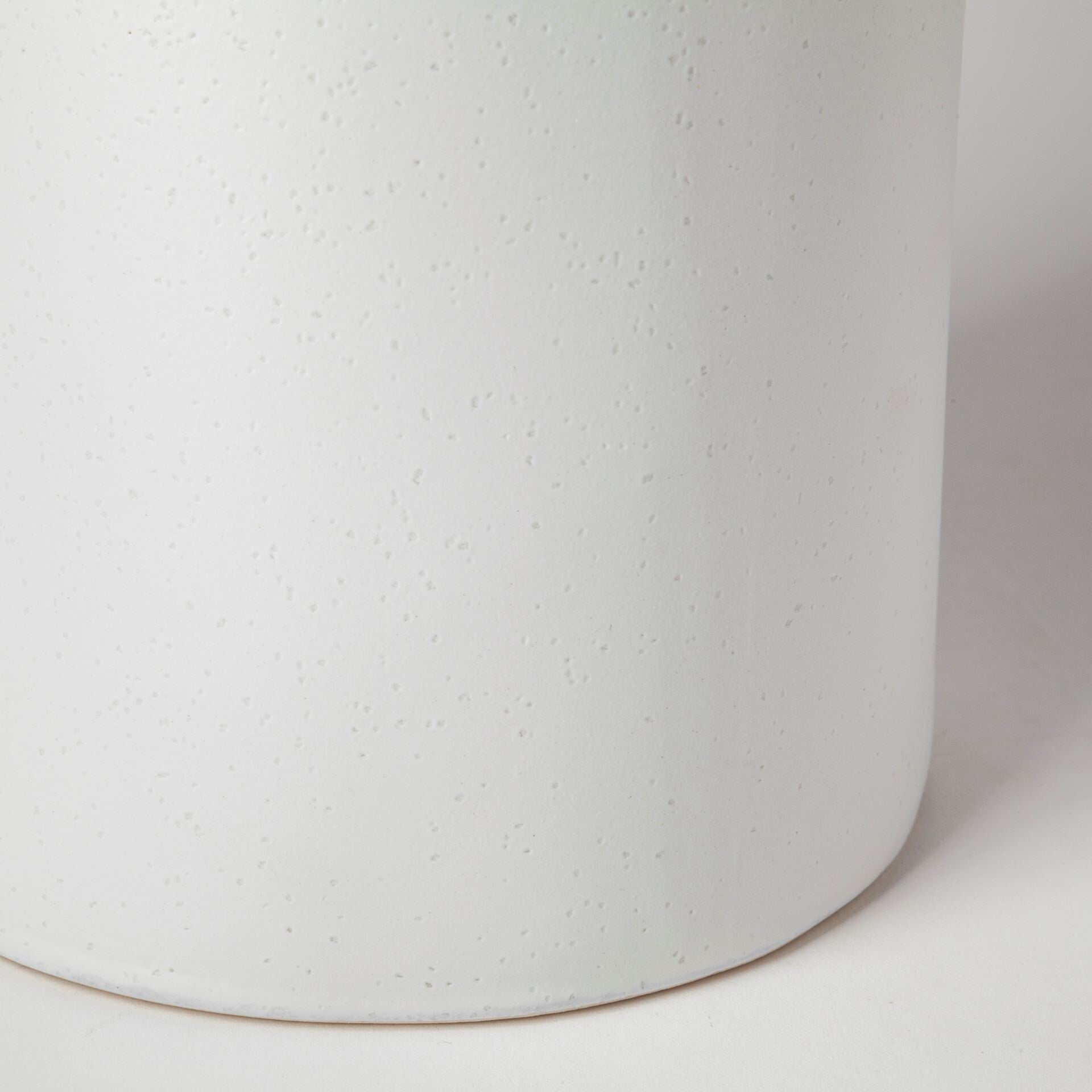 Black and white striped narrow cylinder vase on display, versatile table centerpiece decor
