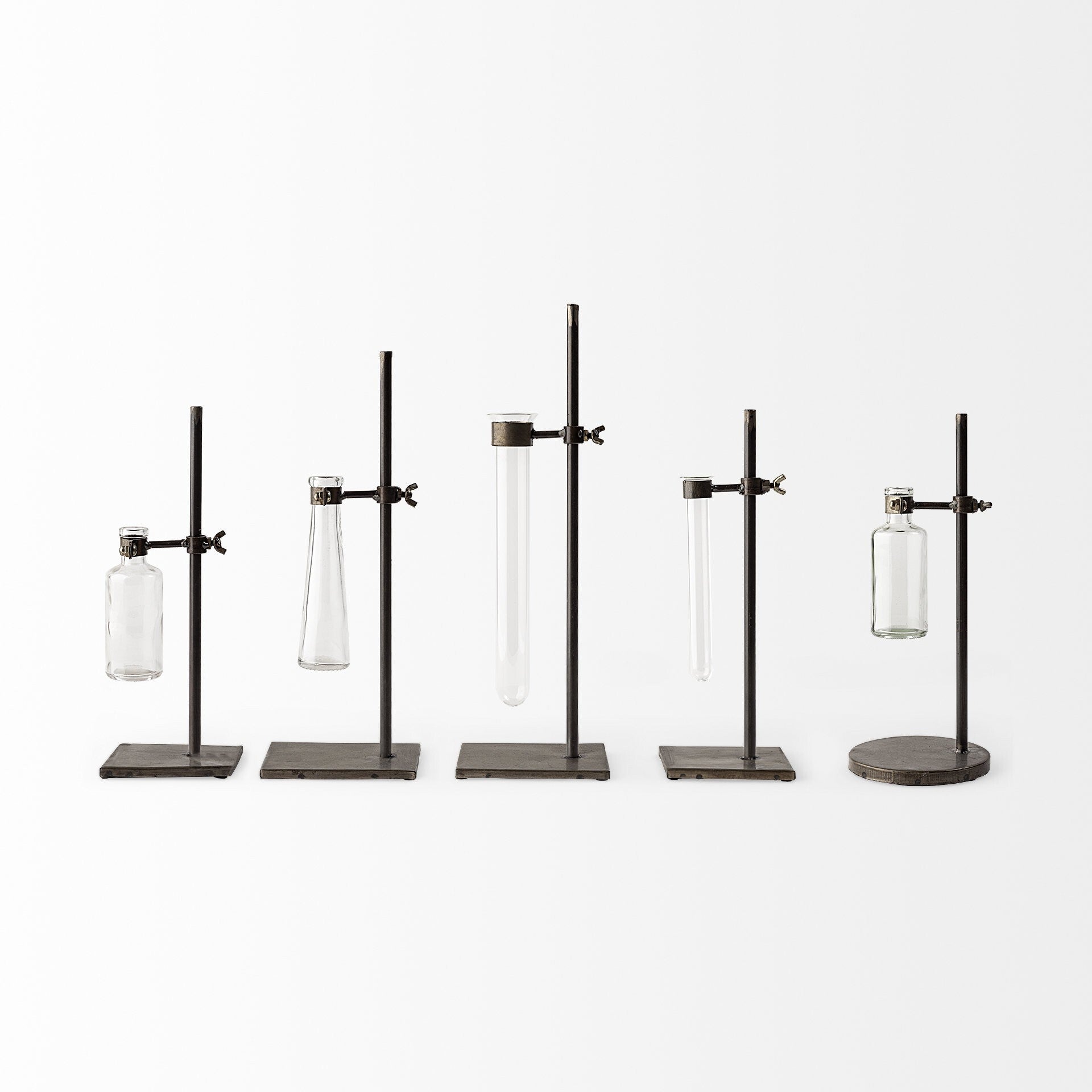 Glass test tube vases detail shot highlighting metal bases and minimalist design
