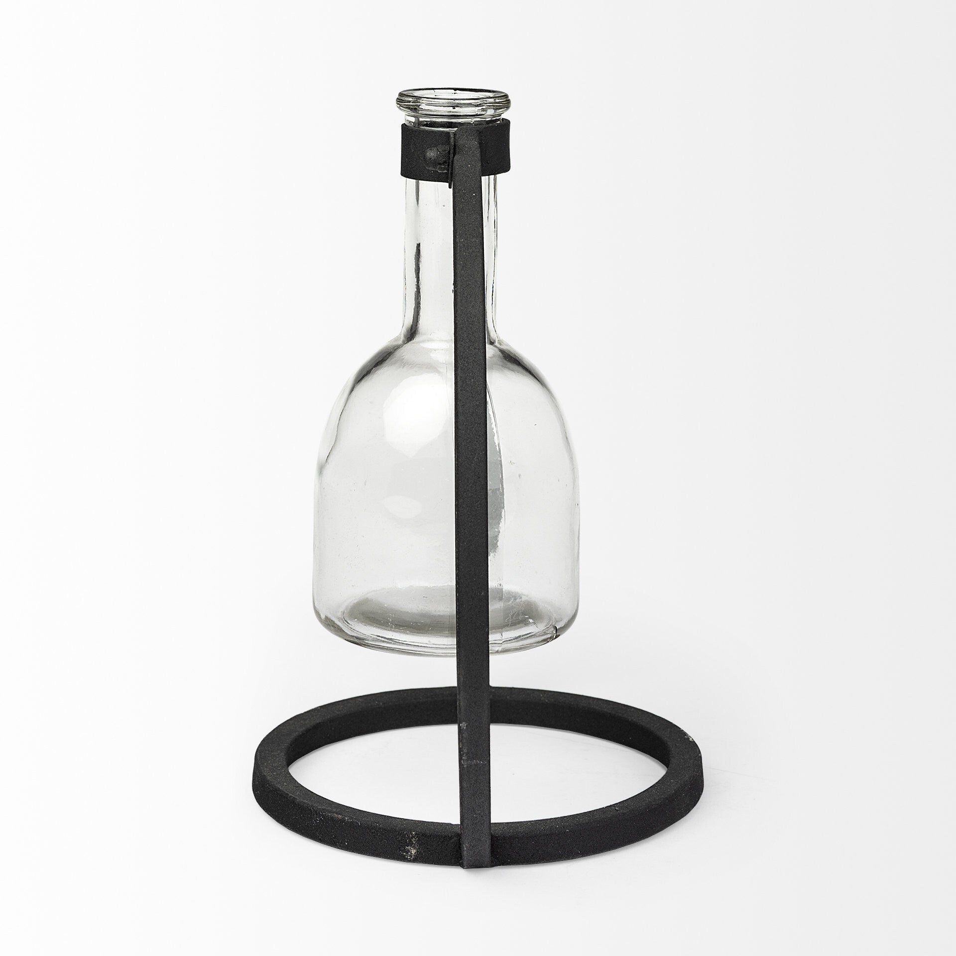 Abstract glass and metal vase side view showing clear cylinder with black accents, modern home decor
