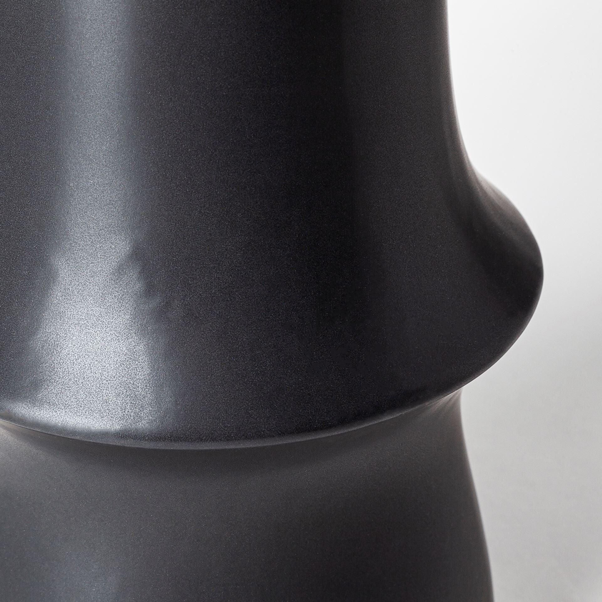 Black decorative ceramic vase alternative angle showing versatile modern home decor piece

