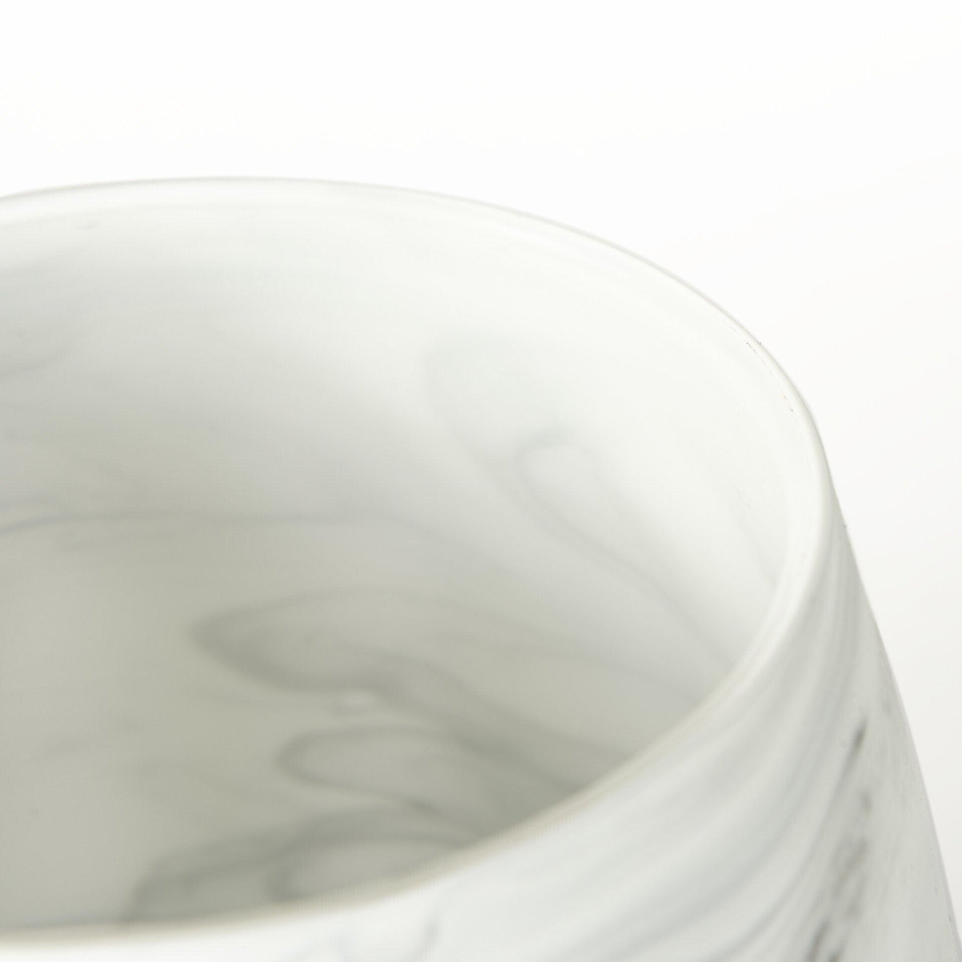 Detail shot of marble pattern glass vase showing sophisticated gray and cream color blend with translucent quality, versatile decorative accent piece
