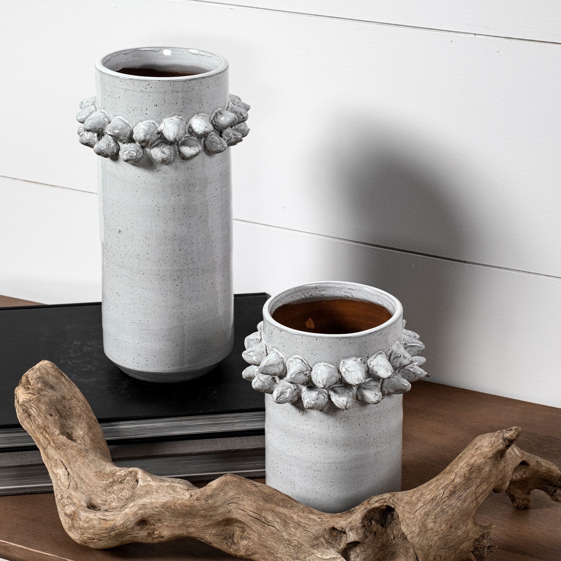 Contemporary 7 inch ceramic vase featuring organic speckled glaze and distinctive 3D spoke detail
