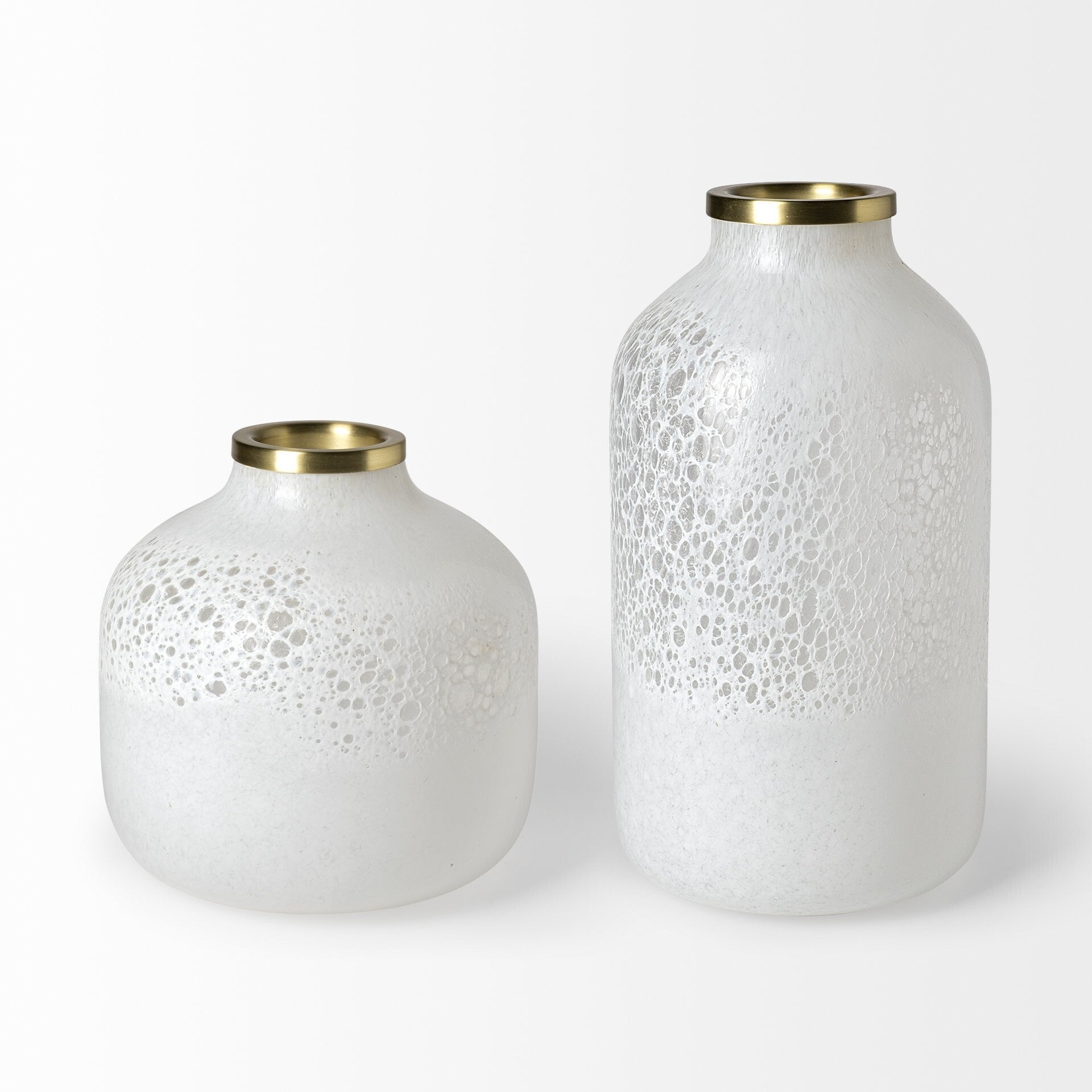 Side angle of modern glass vase displaying unique rounded square bottle shape with pearl white finish and glamorous gold rim detail
