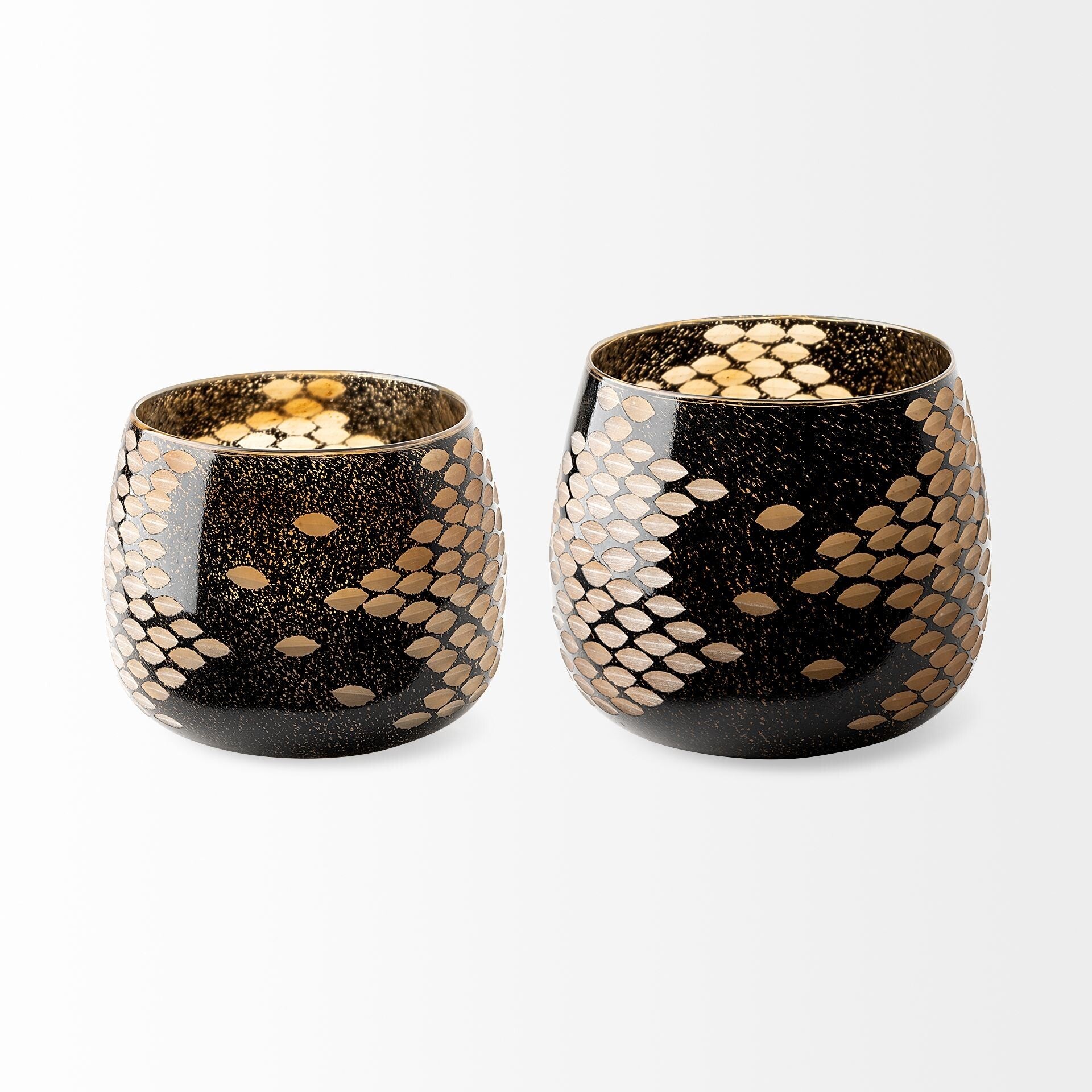 Close-up of snakeskin inspired pattern and gold speckles on black artisan bubble glass vase
