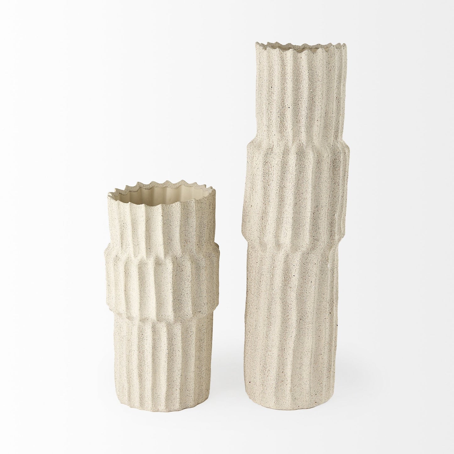Close-up of carved striped pattern and sandy beige texture on jumbo organic ceramic vase
