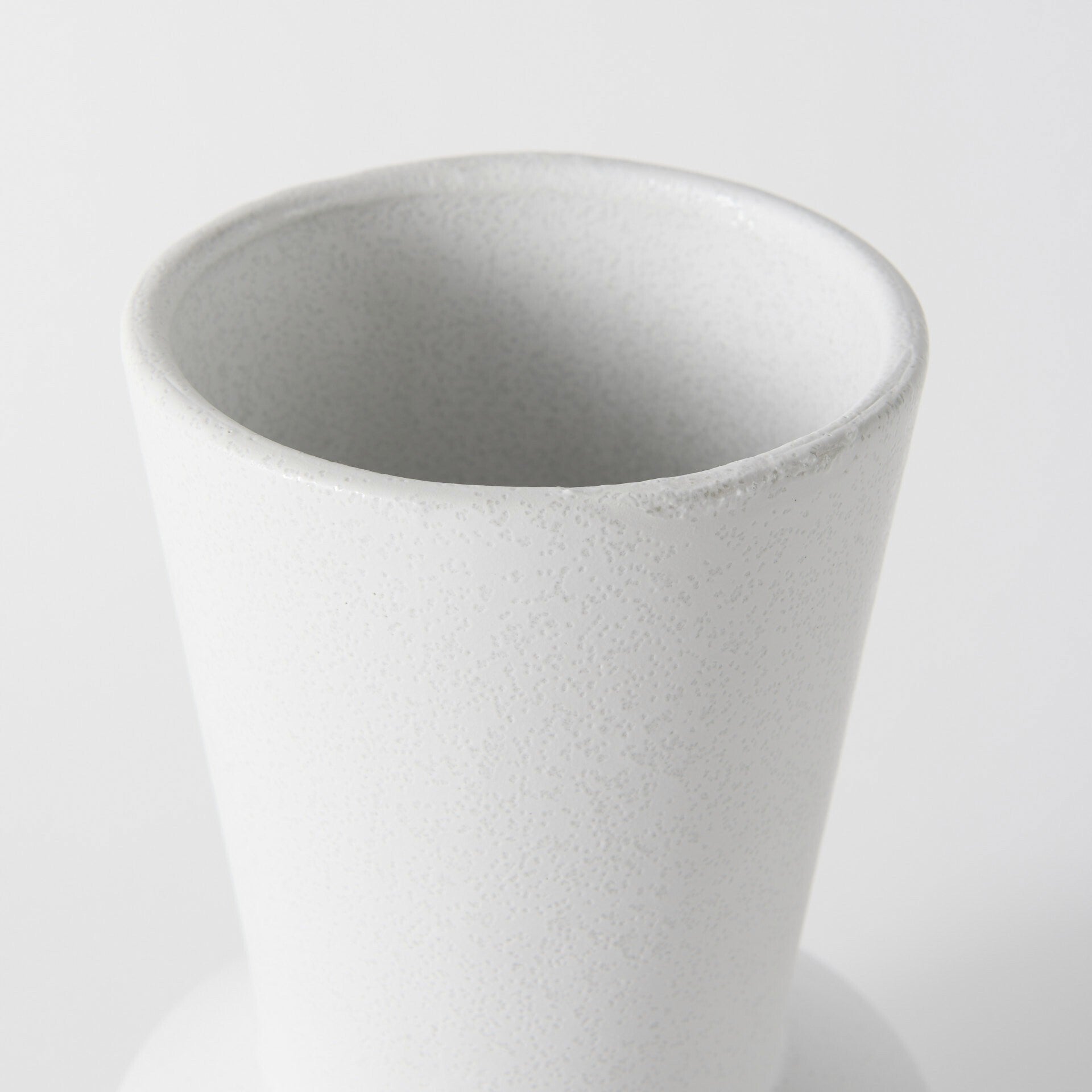 White decorative ceramic vase alternative angle showing versatile modern home decor piece
