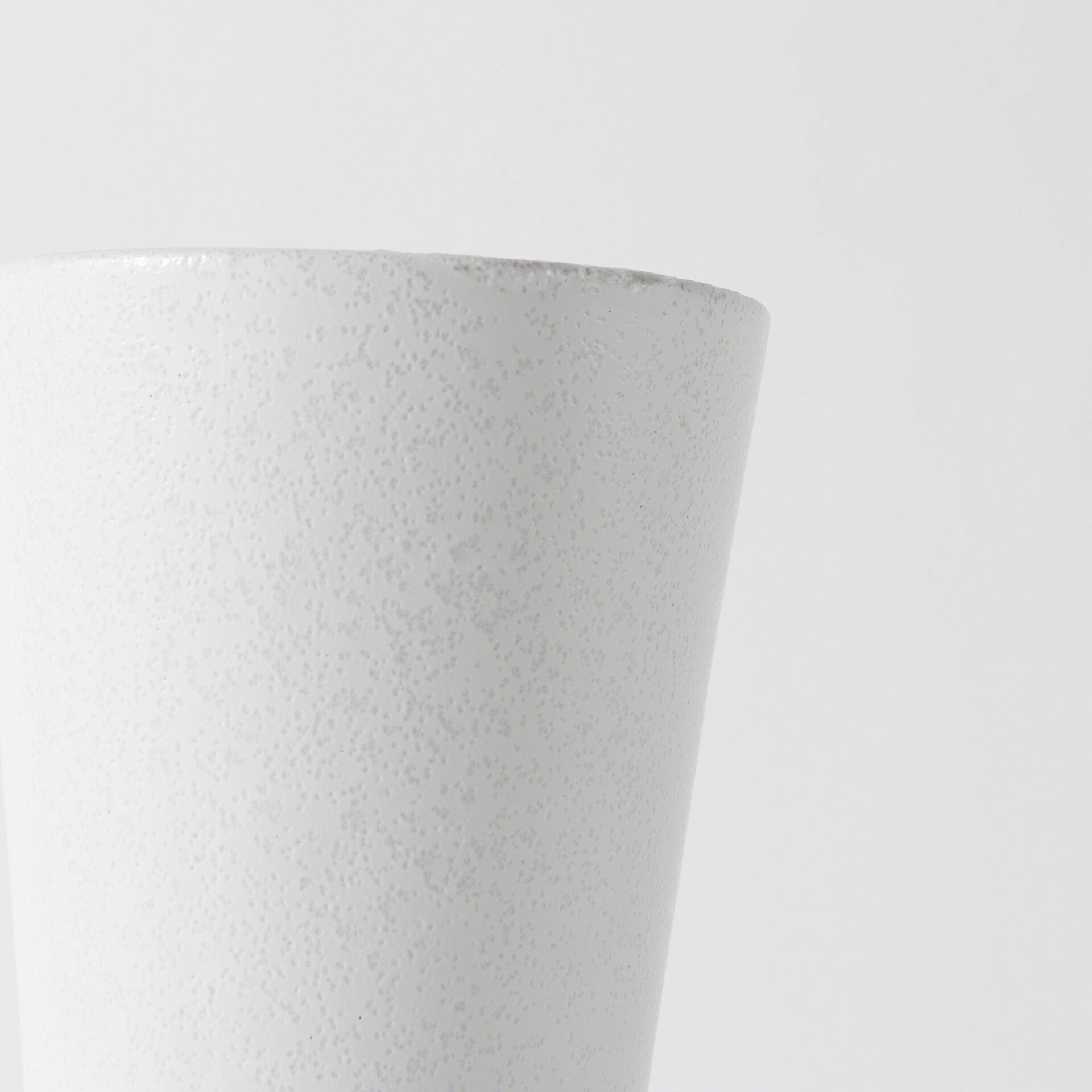 White ceramic vase full view demonstrating 9 inch height ideal for small to medium arrangements

