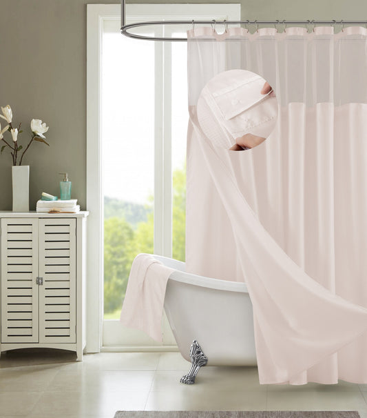 Close-up view of blush pink cotton shower curtain showing delicate grid pattern and sheer fabric texture
