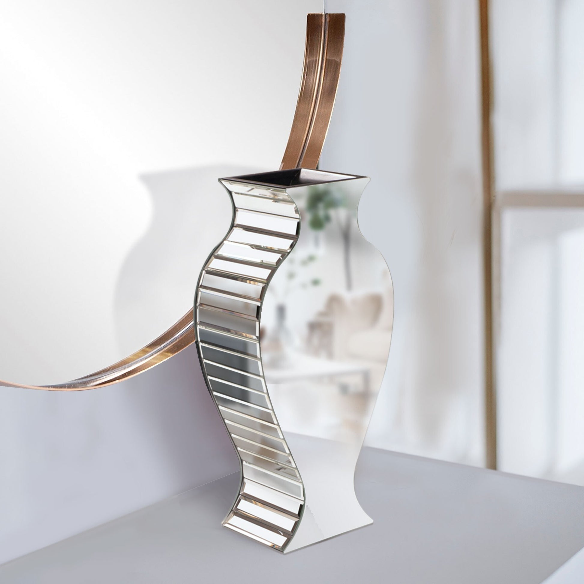 Beveled mirror vase detail showcasing light reflections and geometric panel design, perfect for upscale event decorations
