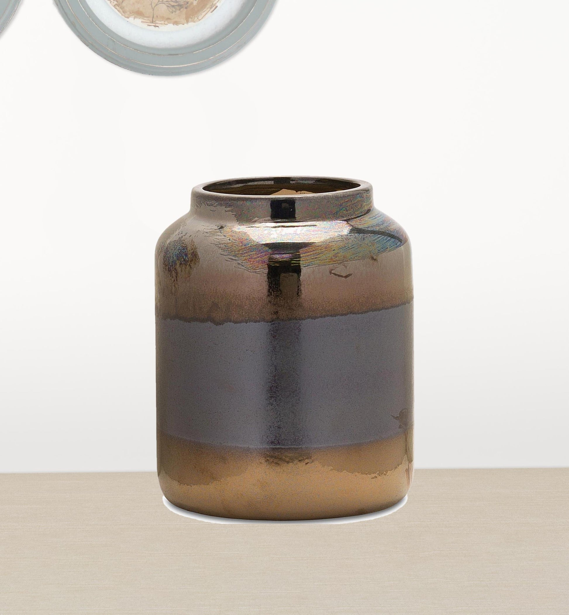 Contemporary clay vase close-up displaying bold black and blue stripe design and quality construction
