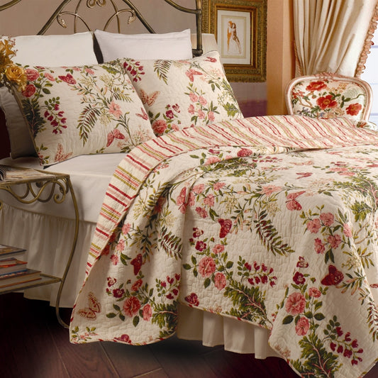 Full Queen cotton quilt set with crimson clover floral pattern on bed with matching pillow shams showing garden-inspired design and vermicelli quilting
